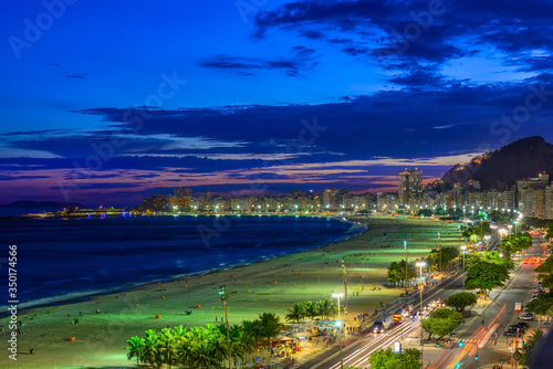Night view of Copacabana beach and Avenida Atlantica in Rio de Janeiro, Brazil