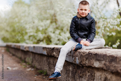 seven-year-old boy in a leather jacket