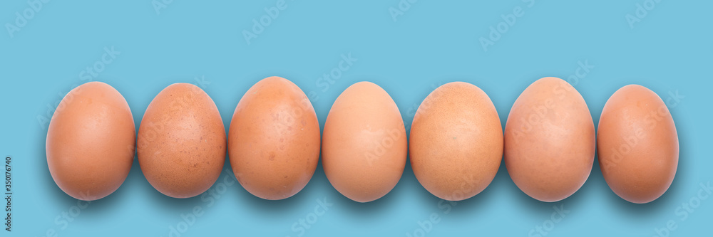 Pastel Easter eggs aligned, green background Pastel Easter eggs aligned, green background