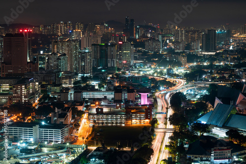 Panoramic view of Kuala Lumpur skyline at night time. City center of capital of Malaysia. Illumination lights contemporary buildings exterior with glass.