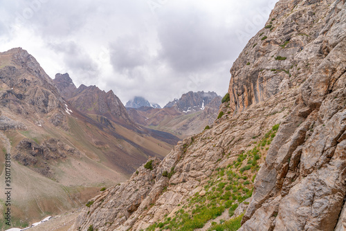 The beautiful view of blue sky and snow mountain summit near to Zmeya peak in Fann mountains in Tajikistan