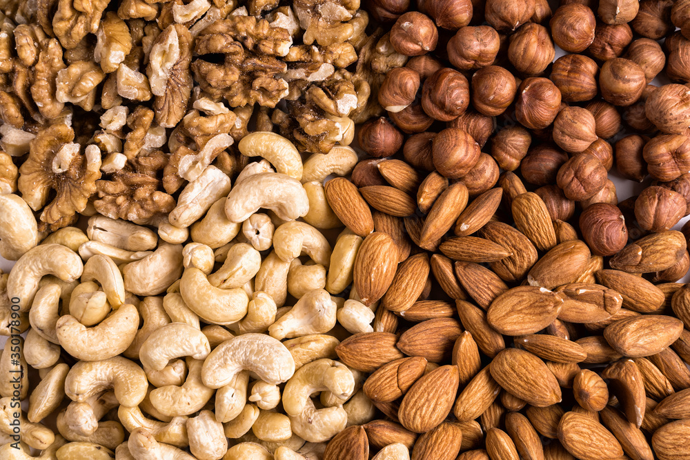 Top view collection of nuts for health, fitness and vitality. Top view collection of nuts for health, fitness and vitality.