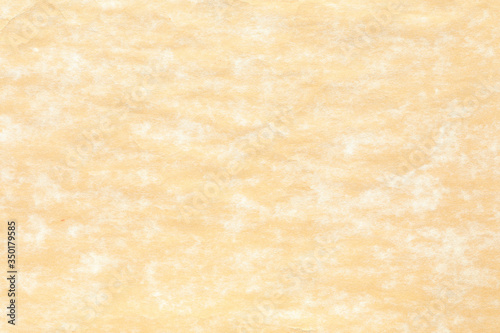 Old yellow paper with white stain 
