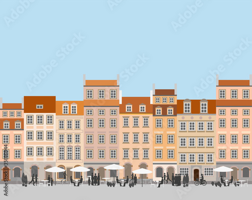 Street life in an old town. A  market square house facades. 