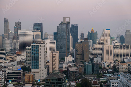 Panoramic view of Bangkok skyline at sunset. Modern city center of capital of Thailand. Contemporary buildings exterior with glass.