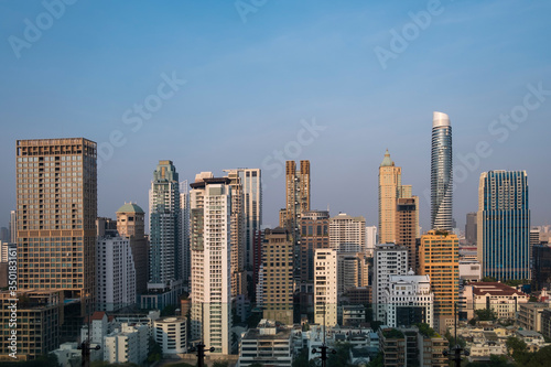 Panoramic view of Bangkok skyline at sunset. Modern city center of capital of Thailand. Contemporary buildings exterior with glass. © VideoFlow