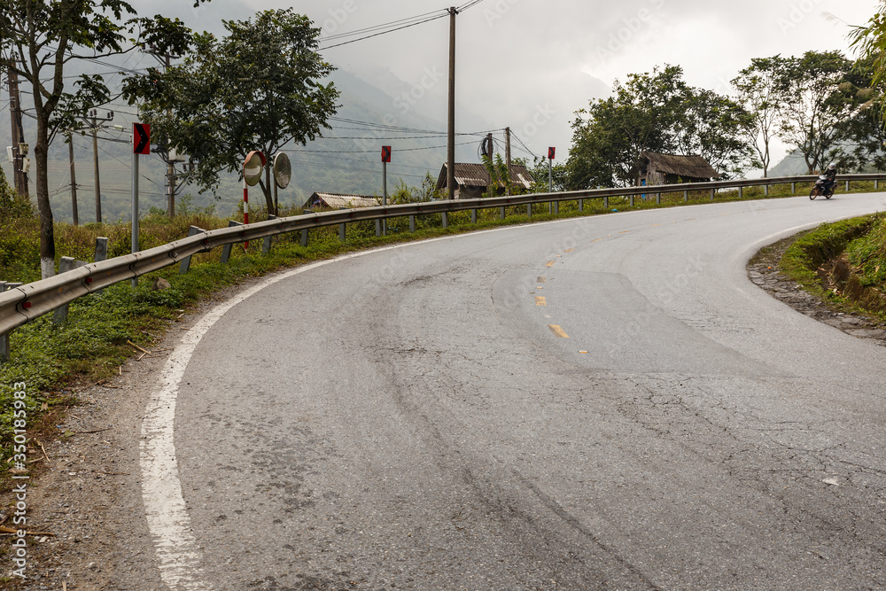 empty asphalt road in beautiful scenic mountains, Sa Pa, Vietnam empty asphalt road in beautiful scenic mountains, Sa Pa, Vietnam