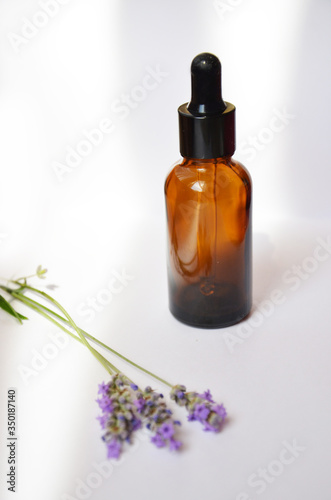 Aromatherapy oil and lavender, lavender spa, Wellness with lavender, lavender syrup on a wooden white background