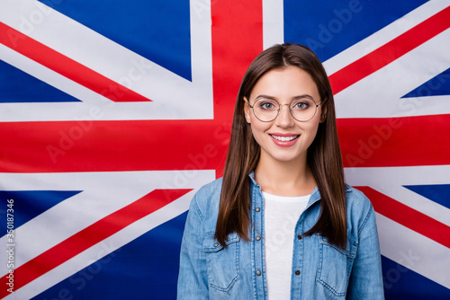 Close-up portrait of her she nice attractive lovely pretty intellectual cheerful cheery girl university college student classes courses isolated over british stripes flag background