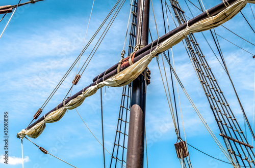 Replica of Nao Victoria ship in Seville, Andalusia, Spain. Detail of the mast. Blue sky.