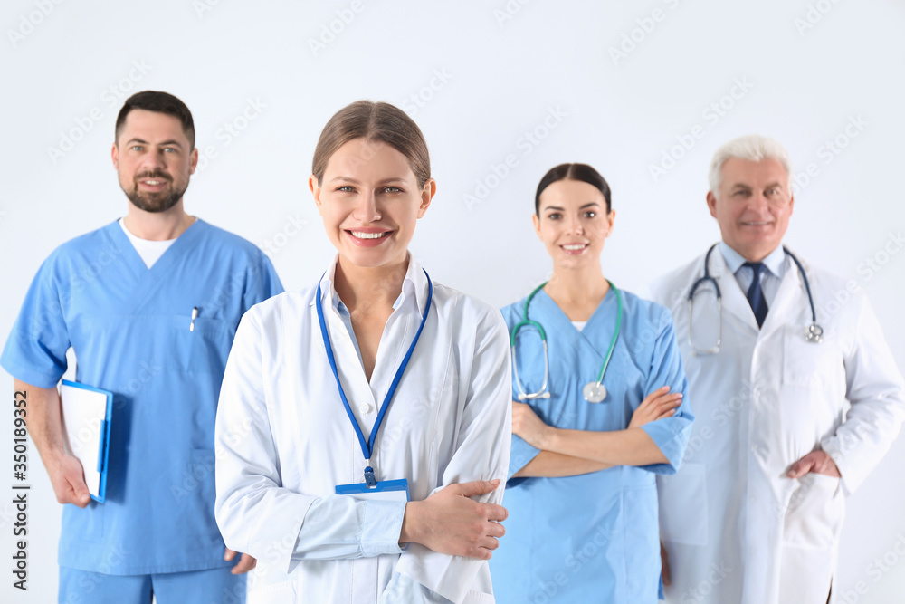 Group of doctors against light background. Medical service Group of doctors against light background. Medical service