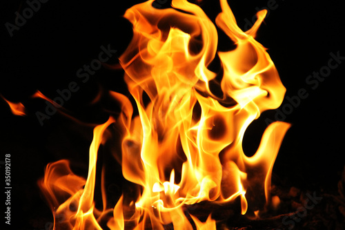 Blaze burning fire flame on the black background © somchai