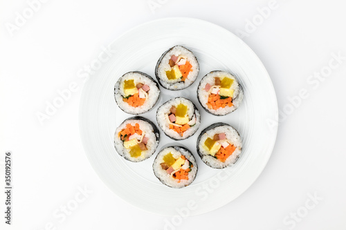 Gimbap with vegetables on white background
