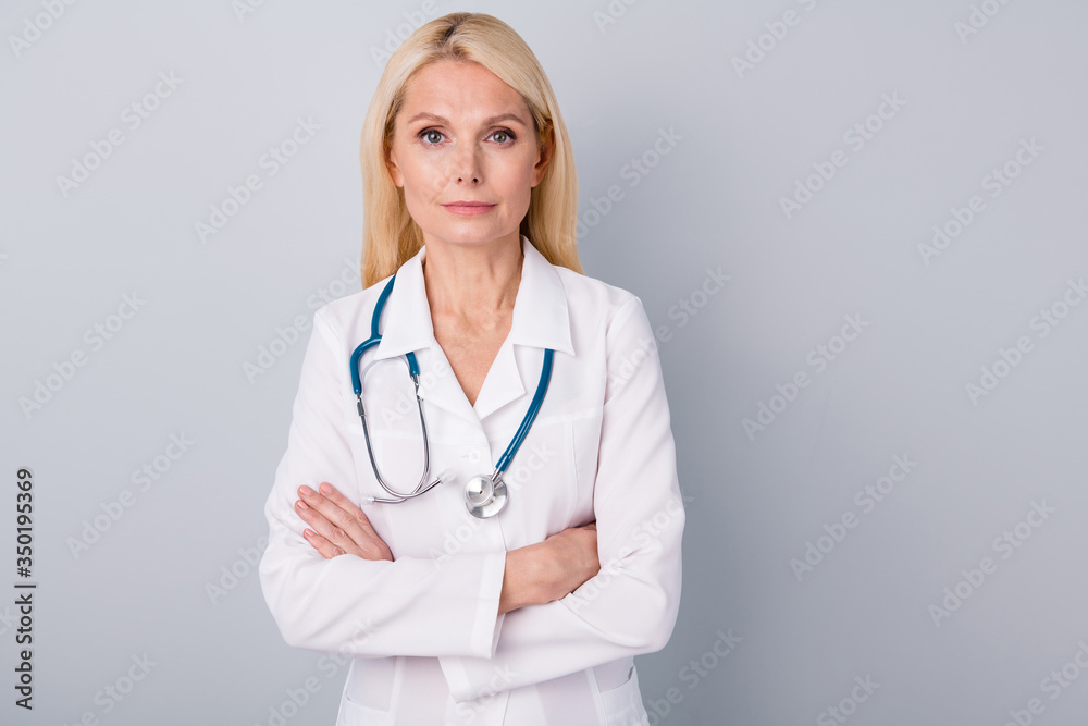 Portrait of strict experienced old woman doc cross hands want stop corona virus world spreading wear white coat isolated over gray color background Portrait of strict experienced old woman doc cross hands want stop corona virus world spreading wear white coat isolated over gray color background