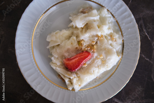 Traditional Turkish Ramadan Dessert Gullac . It is made with gullac (rice wafer or rice paper sheets) , milk, rose water, walnut, vanilla.
