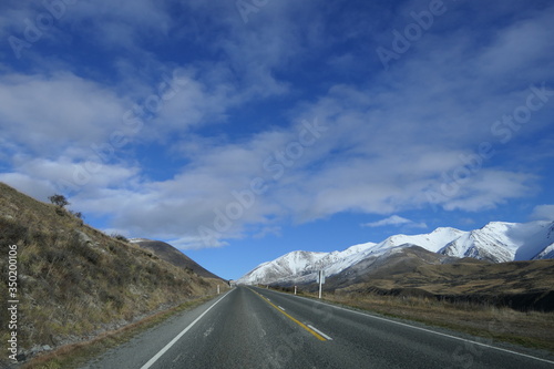 Experience New Zealand: deserted pass road on a journey in the New Zealand mountains on the South Island