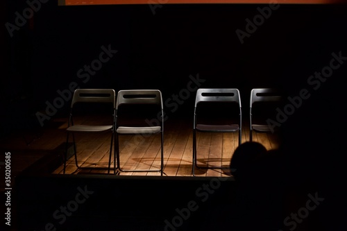 chairs on an empty stage