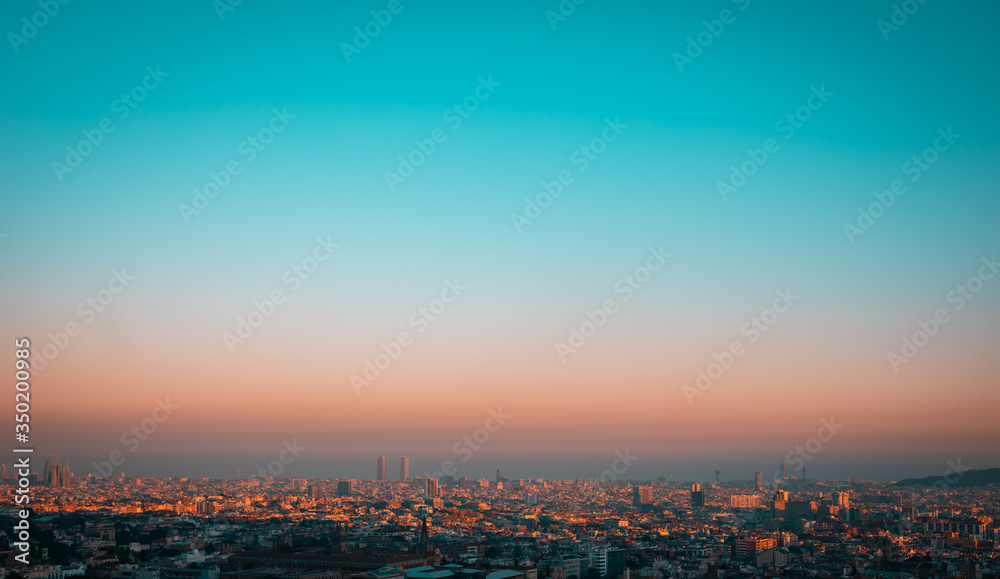 Turquoise sunset showing the contamination over the city of Barcelona