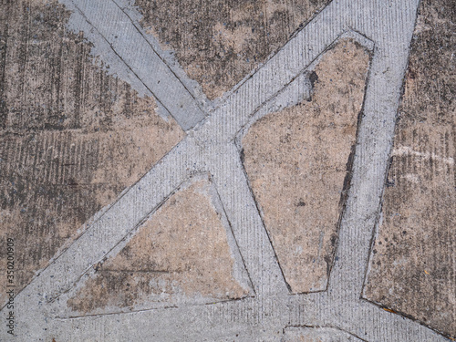 A cement path repair a concrete road