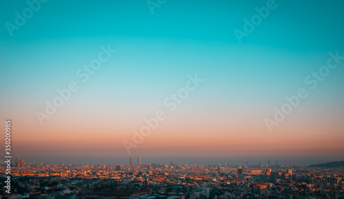 Photography Turquoise sunset showing the contamination over the city of Barcelona