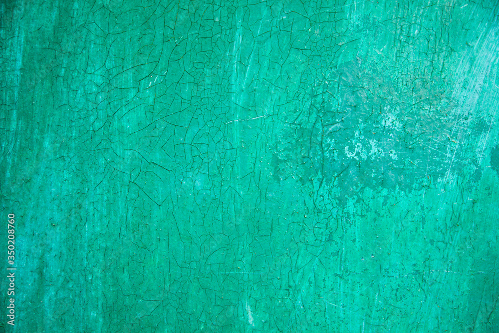cracked green background. grunge texture, decorative emerald wooden background. free space, place for text