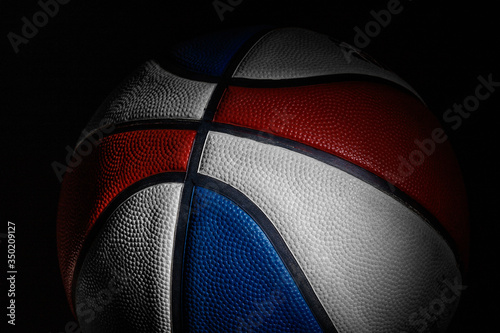 Basketball ball. Professional sport equipment isolated on black studio background. Concept of sport, leadership, competition, healthy lifestyle in motion and action, training. Close up, copyspace. © master1305