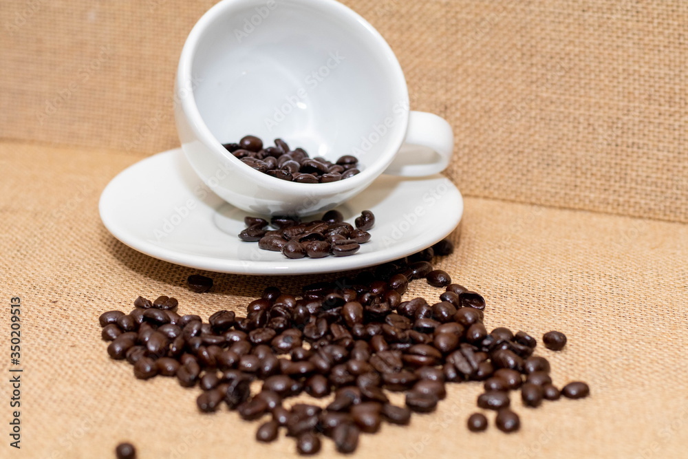 Cup of coffee with coffee beans on old background Cup of coffee with coffee beans on old background