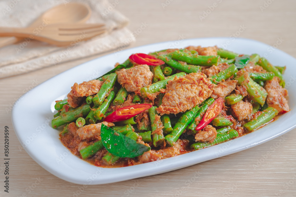 Stir fried pork with yard long bean and red curry paste, Thai food