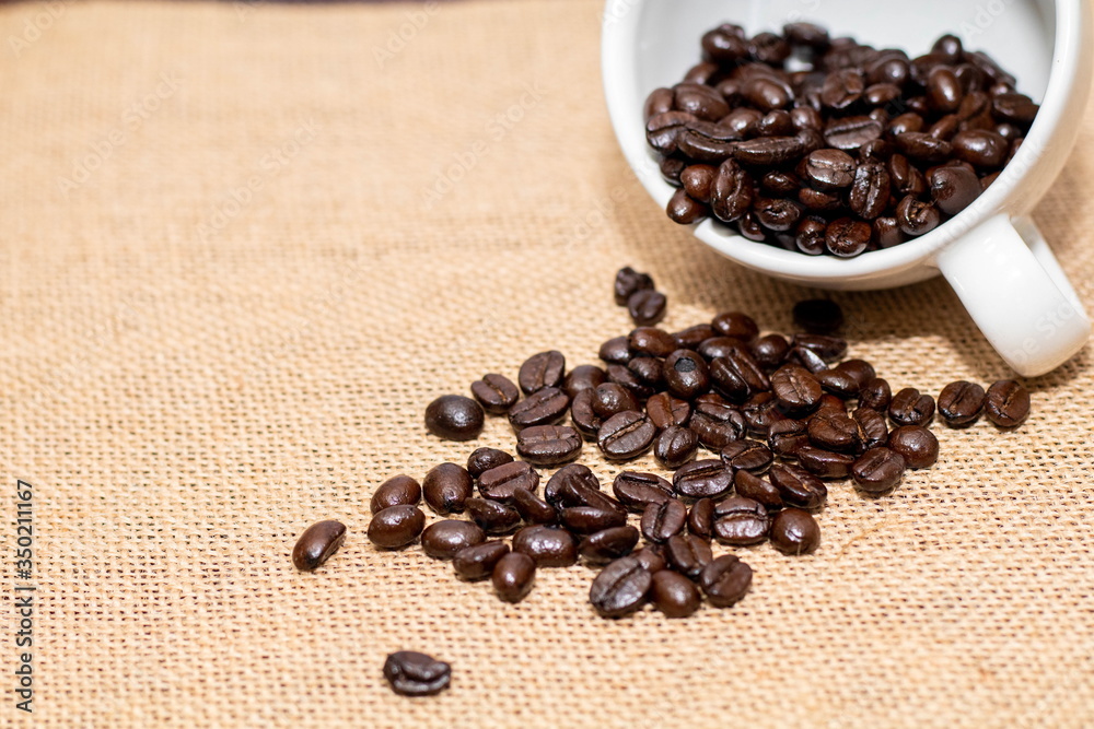 Cup of coffee with coffee beans on old background Cup of coffee with coffee beans on old background