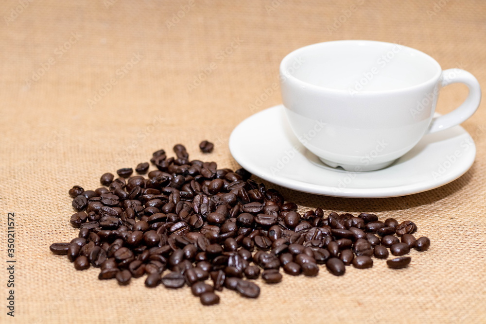 Cup of coffee with coffee beans on old background Cup of coffee with coffee beans on old background
