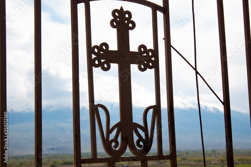 iron cross in mountain background