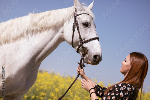 Woman enjoy in break with her horse
