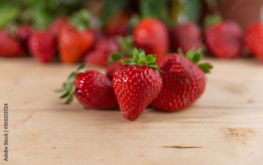 fresh strawberries on a wooden table