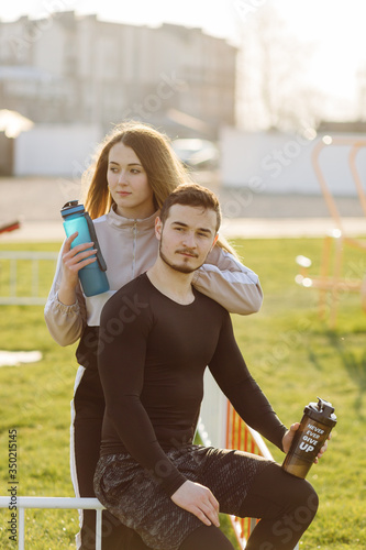 Fototapeta Naklejka Na Ścianę i Meble -  Friends fitness training together outdoors living active healthy