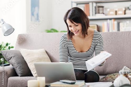 Woman checking her electricity bill