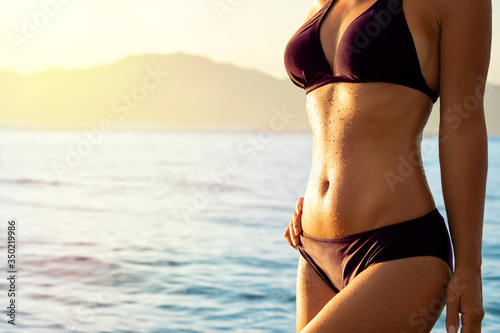 Attractive female fit body in bikini фототапет