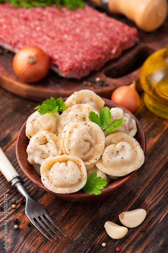 Delicious homemade pelmeni with parsley