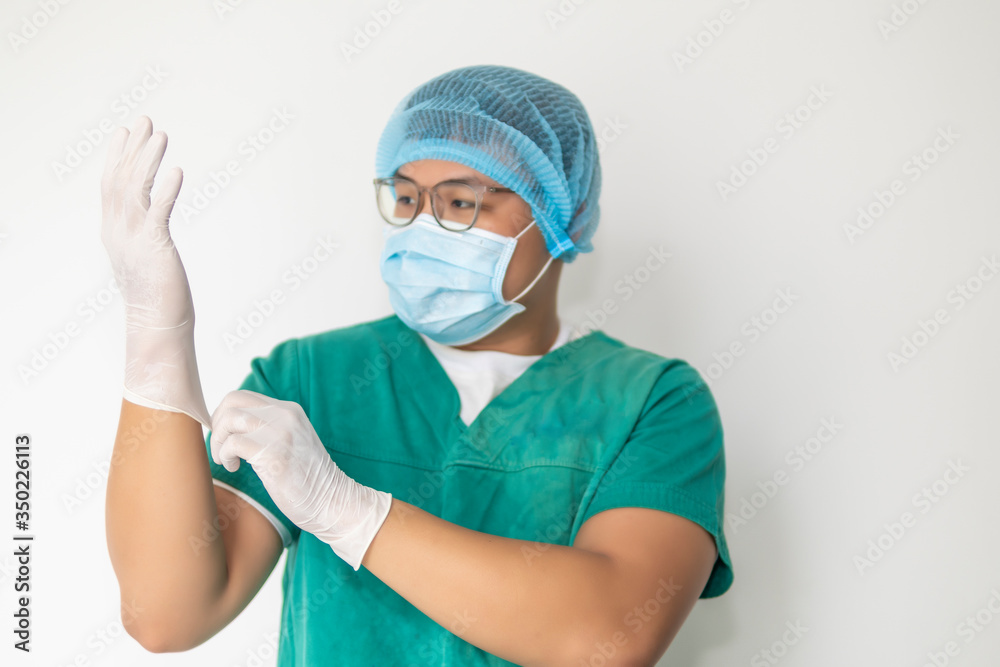 Doctor Puts on Gloves and Wearing Medical Mask. Covid-19, Corona Virus concept Doctor Puts on Gloves and Wearing Medical Mask. Covid-19, Corona Virus concept