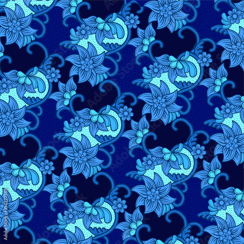 Traditional floral pattern batik drawing with dots and curly lines.