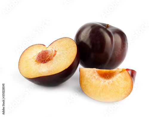ripe plums on white background