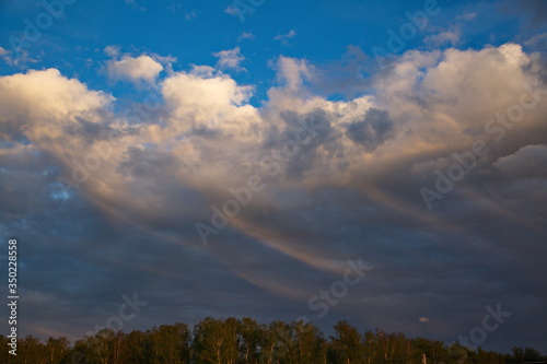 Sunset in the sky over the country settlement, Moscow region, Russia.