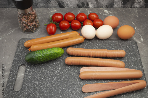 Student breakfast of eggs and tomatoes with sausage