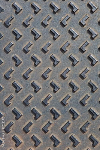 Manhole cover metallic back...