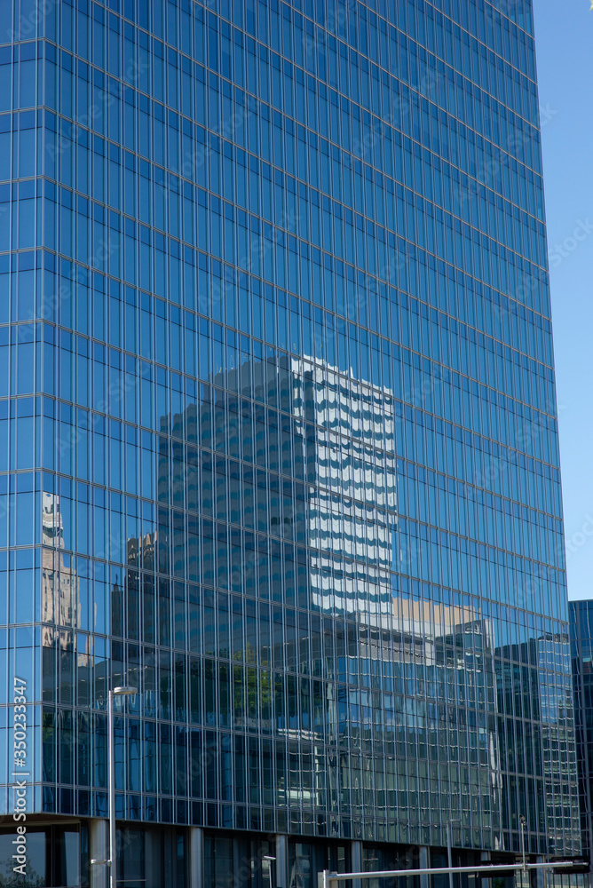 reflections of skyline in a skyscraper reflections of skyline in a skyscraper