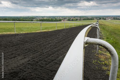 Photos Deep depth of field of white track barriers seen extending to the far distance