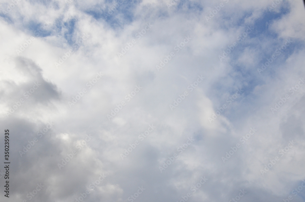 White clouds in blue sky without sun