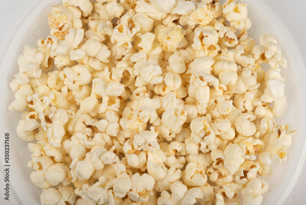 Popcorn in white plate on white background Popcorn in white plate on white background