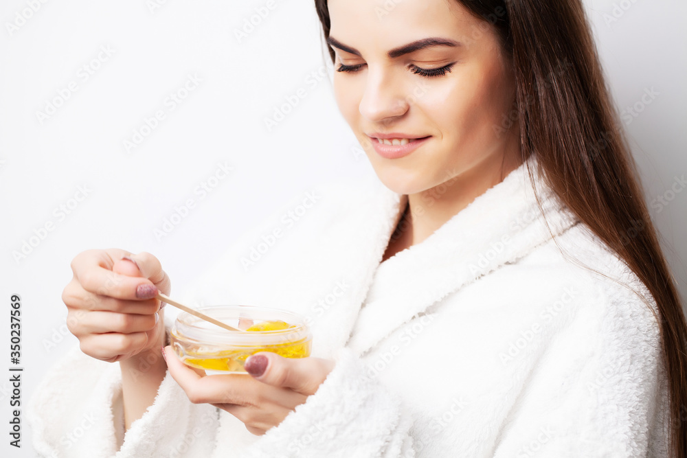 Hot wax in white bowl for hair removal Hot wax in white bowl for hair removal