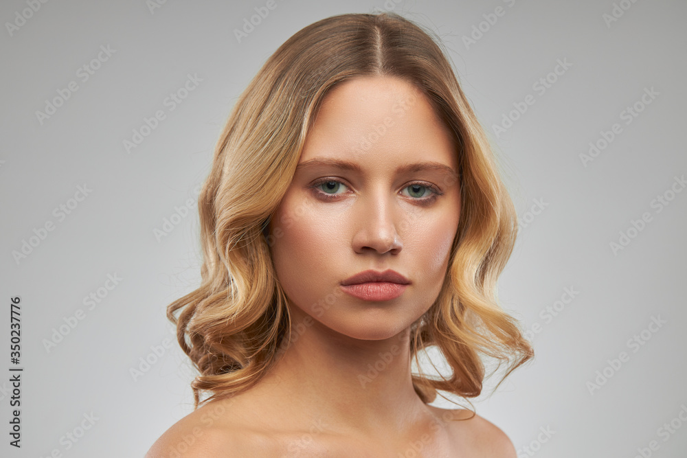 Petty face of blonde woman with no makeup. Petty face of blonde woman with no makeup.