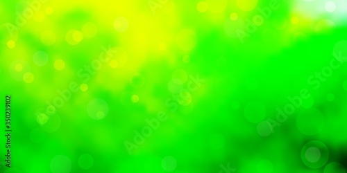 Light Green, Yellow vector background with bubbles. Abstract colorful disks on simple gradient background. Design for your commercials.